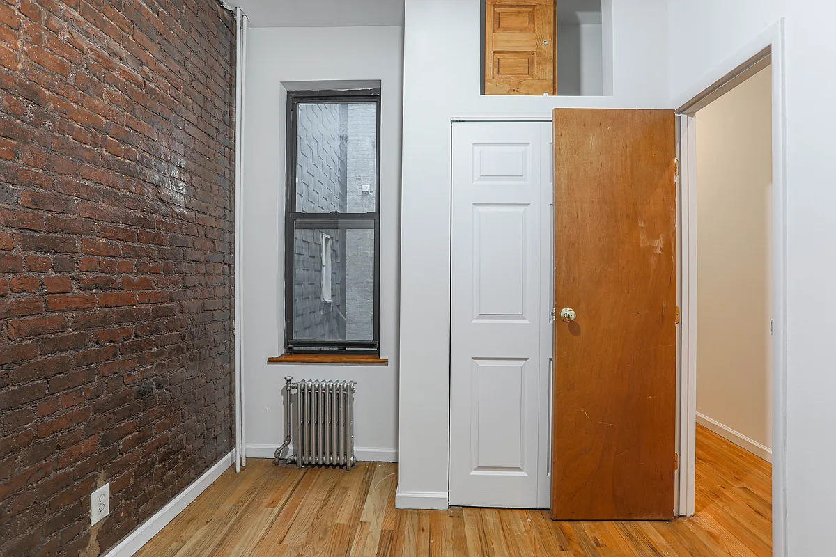 199 Java Street Brooklyn, NY 11222 - Photo 20 of 32 a view of a hallway with wooden floor and front door