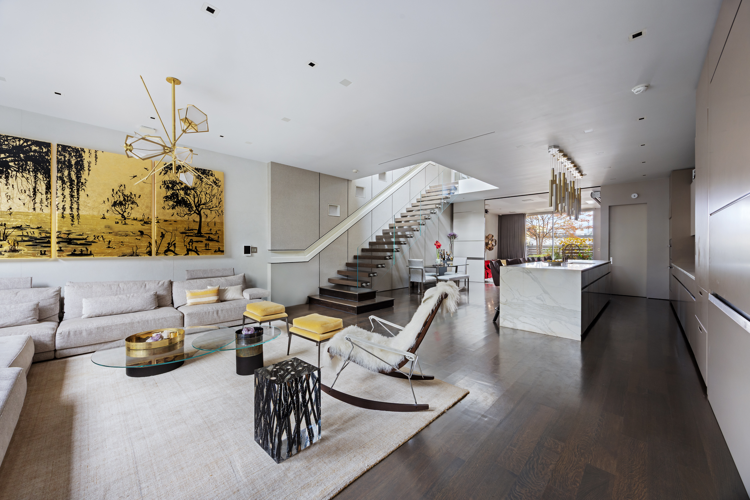 a dining room with furniture and wooden floor