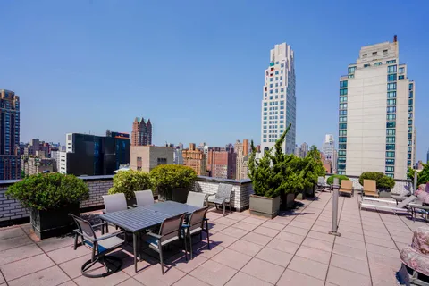 a view of a terrace with furniture and a potted plant