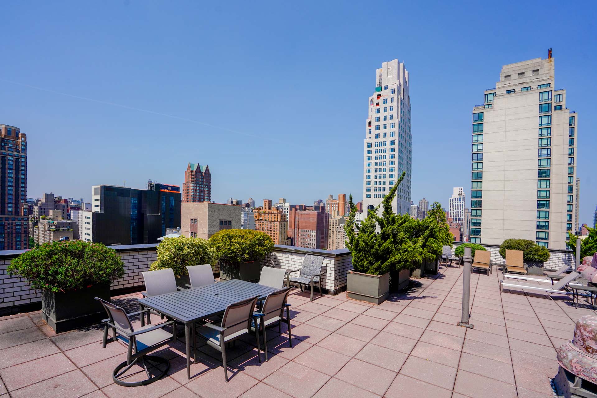 301 East 75th Street, Unit 2G Manhattan, NY 10021 - Photo 8 of 14 a view of a terrace with furniture and a potted plant