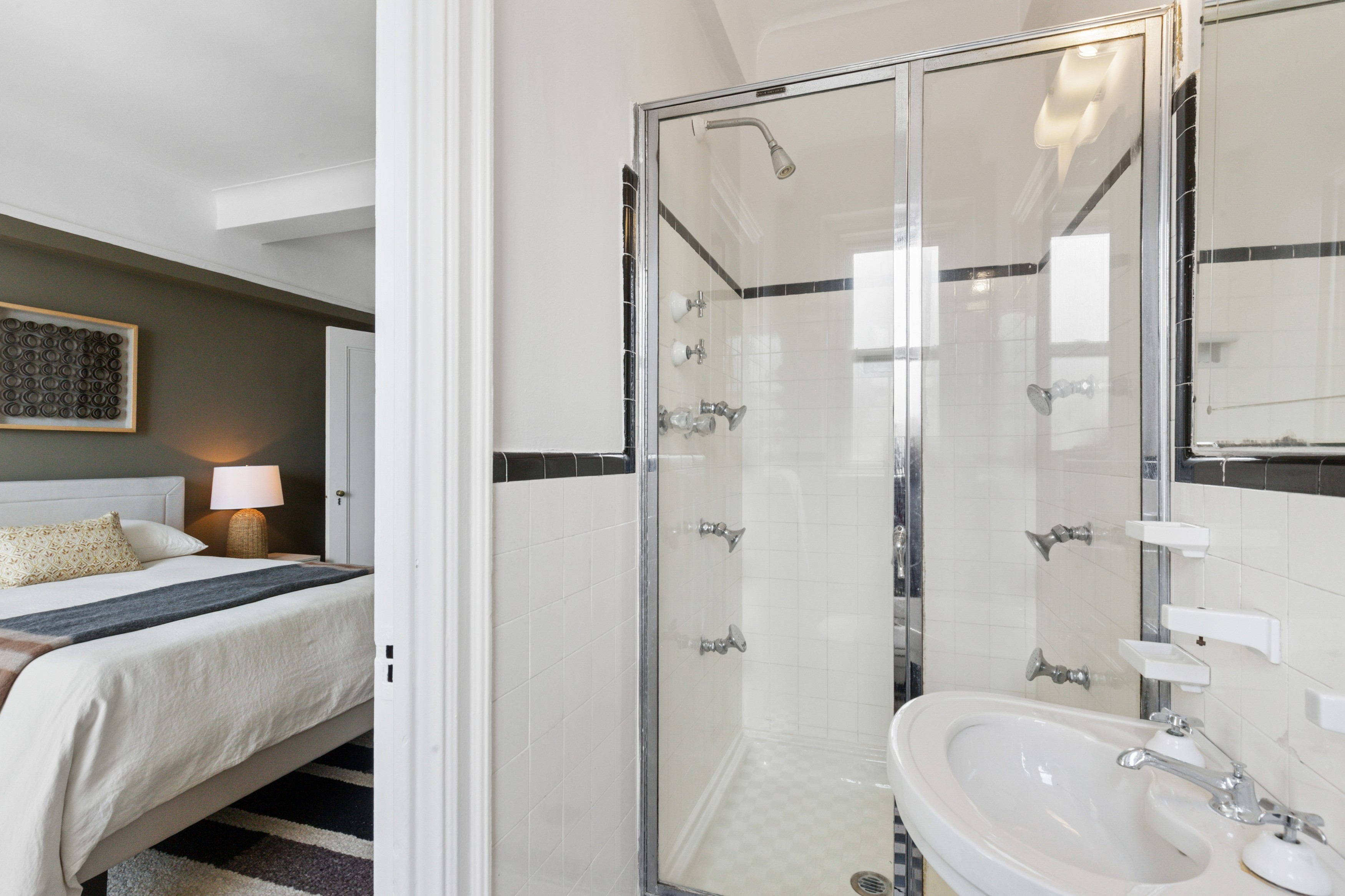 336 Central Park West, Unit 16F Manhattan, NY 10025 - Photo 15 of 18 a bathroom with a sink toilet double vanity and shower