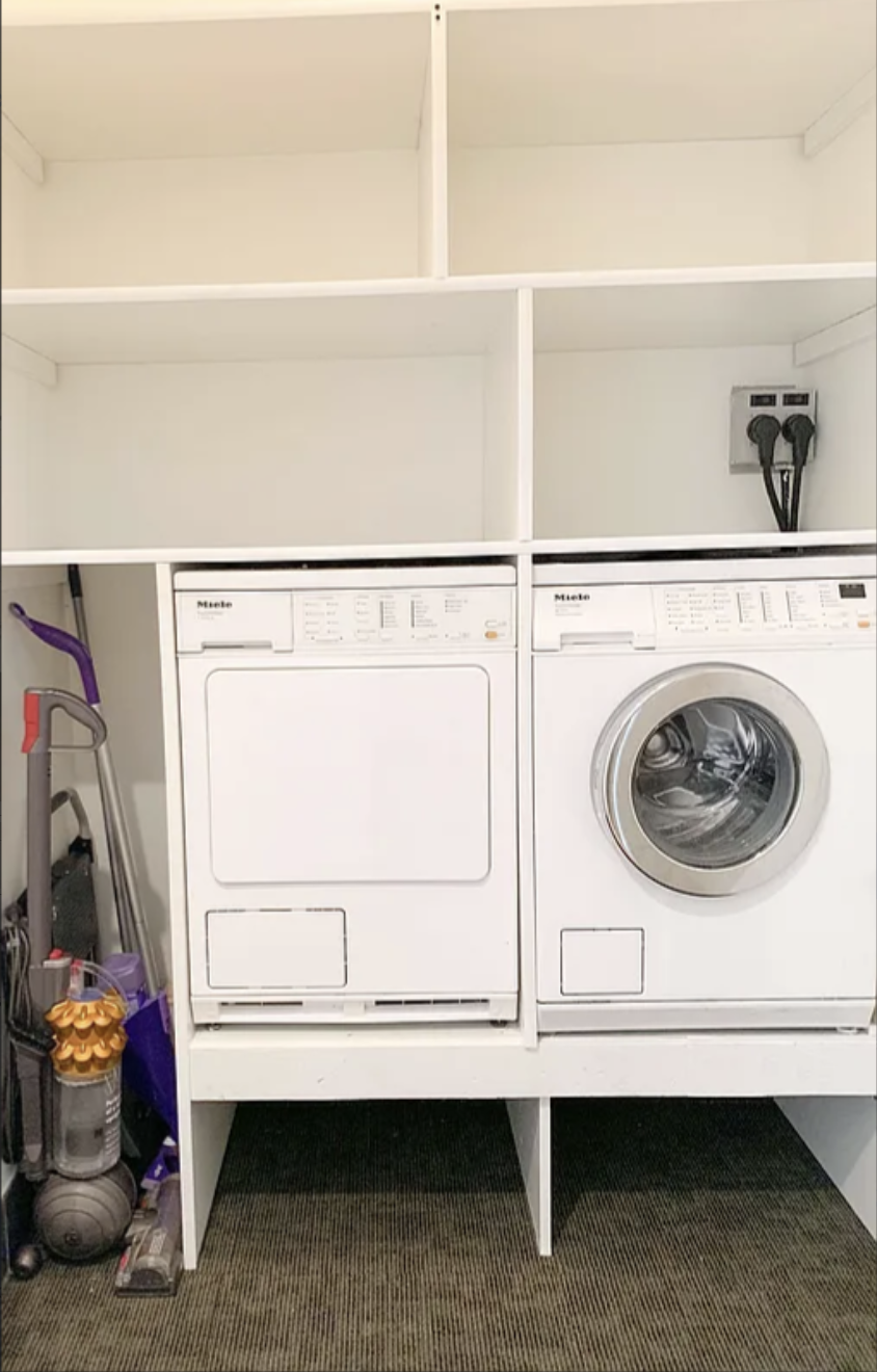 450 West 17th Street, Unit 1811 Manhattan, NY 10011 - Photo 8 of 14 a utility room with dryer and washer