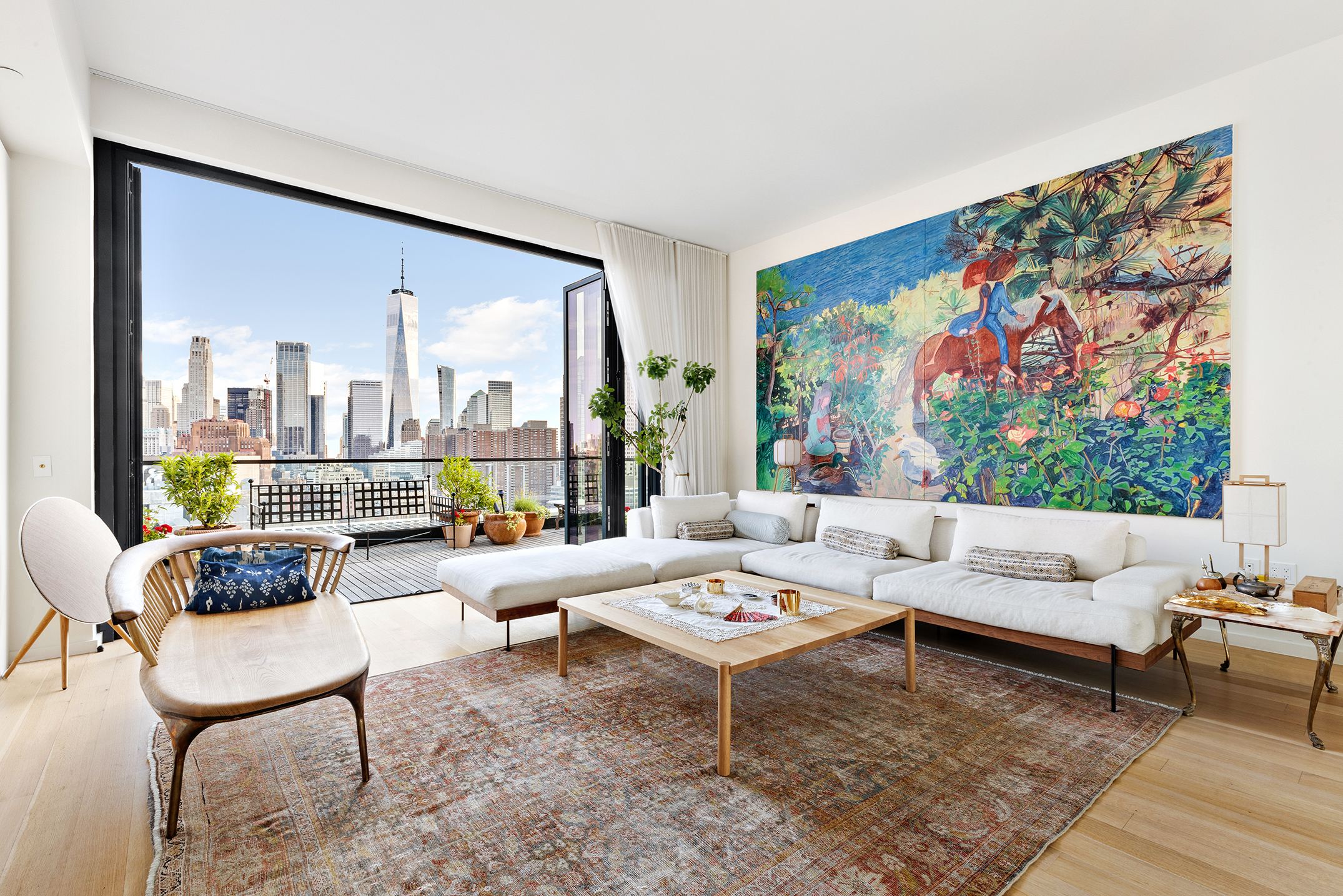 570 Broome Street, Unit PHA Manhattan, NY 10013 - Photo 2 of 22 a living room with furniture and a large window