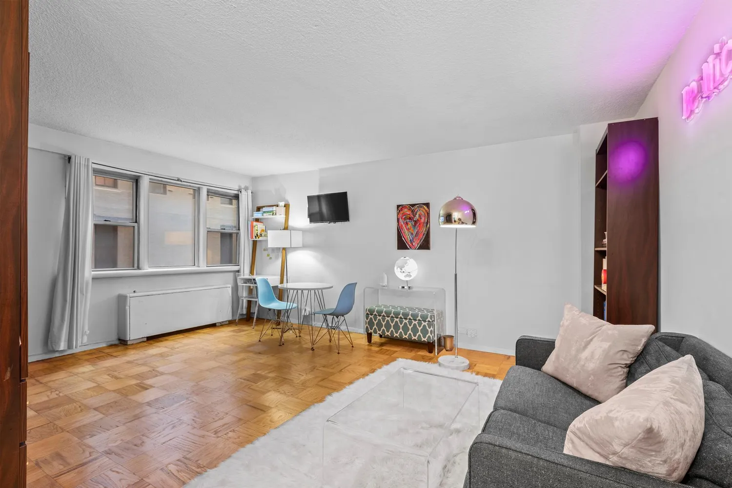 a living room with furniture and a window