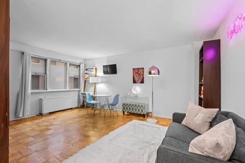 a living room with furniture and a window