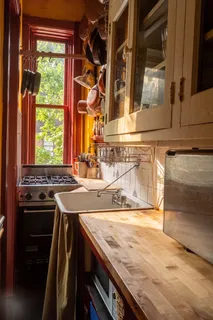 a kitchen with a stove and a sink