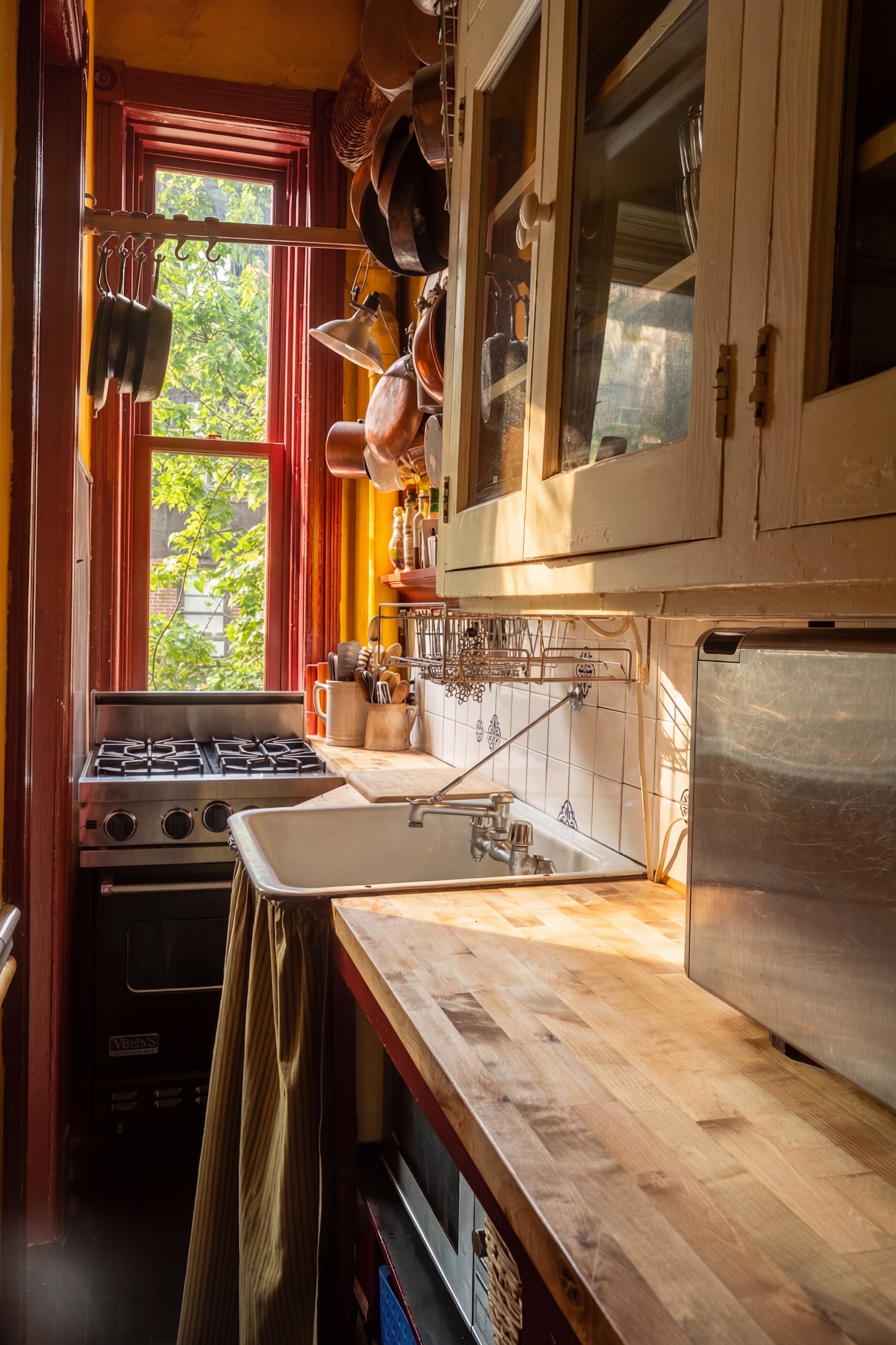 426 West 160th Street Manhattan, NY 10032 - Photo 9 of 33 a kitchen with a stove and a sink