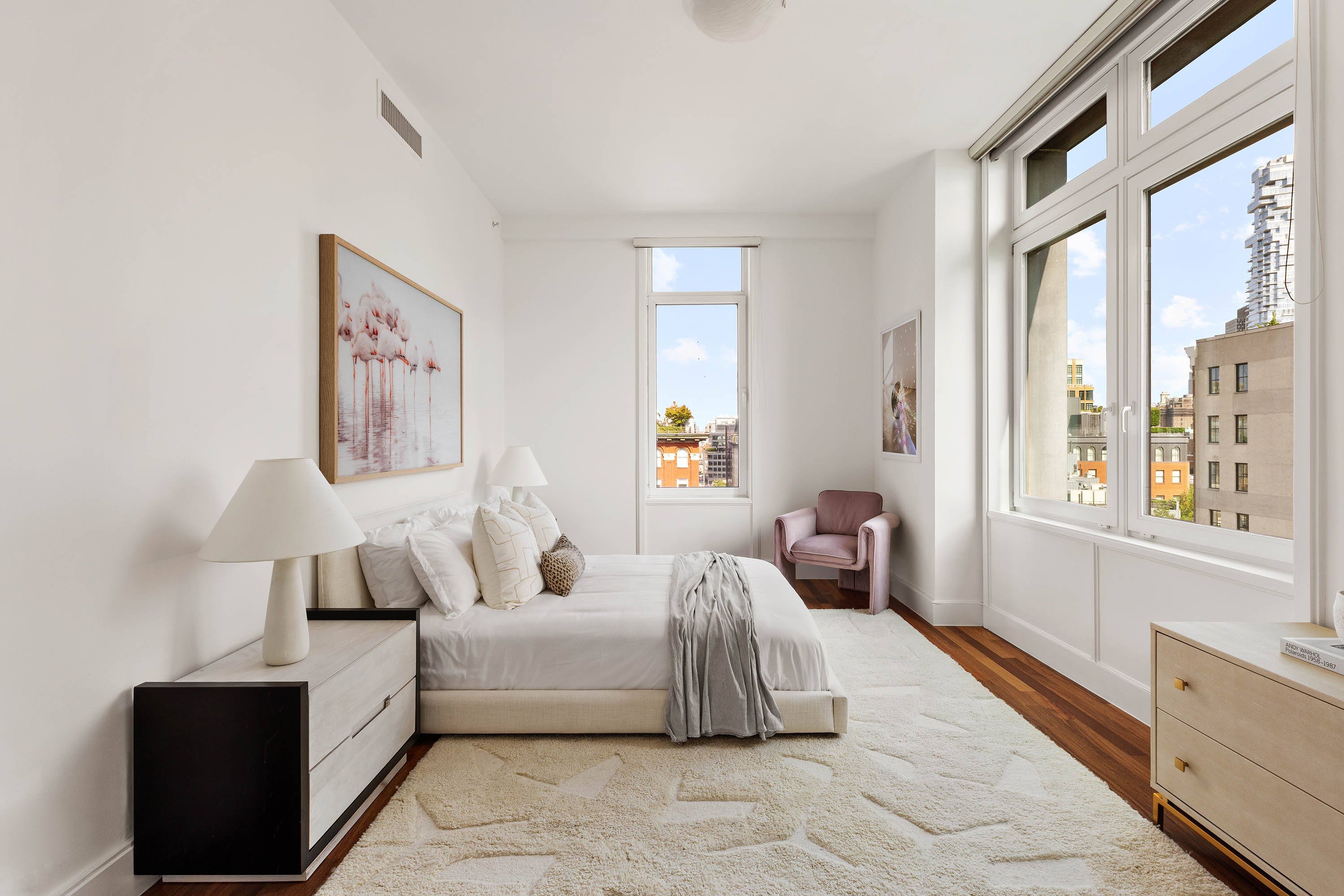 92 Laight Street, Unit 11A Manhattan, NY 10013 - Photo 9 of 15 a spacious bedroom with a bed and a large window