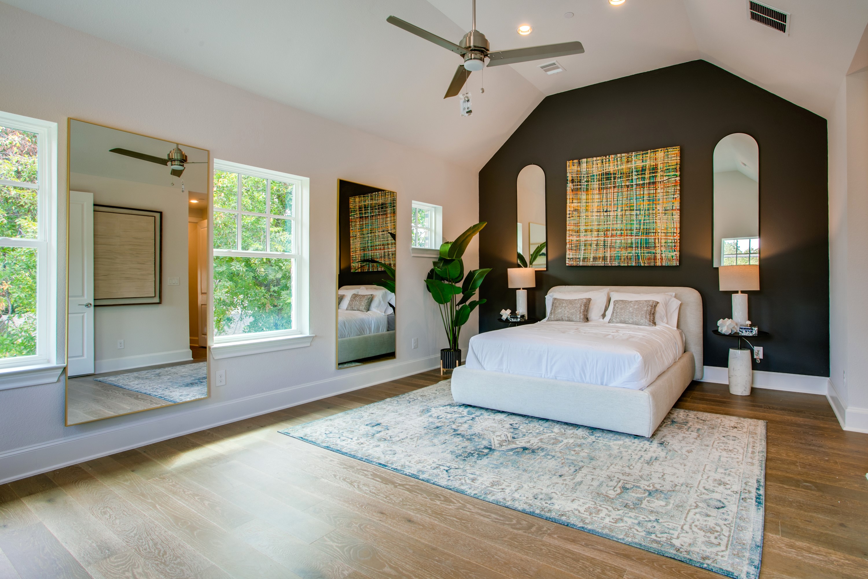 1408 N Avenue Plano, TX 75074 - Photo 10 of 13 a spacious bedroom with a large bed and a large window