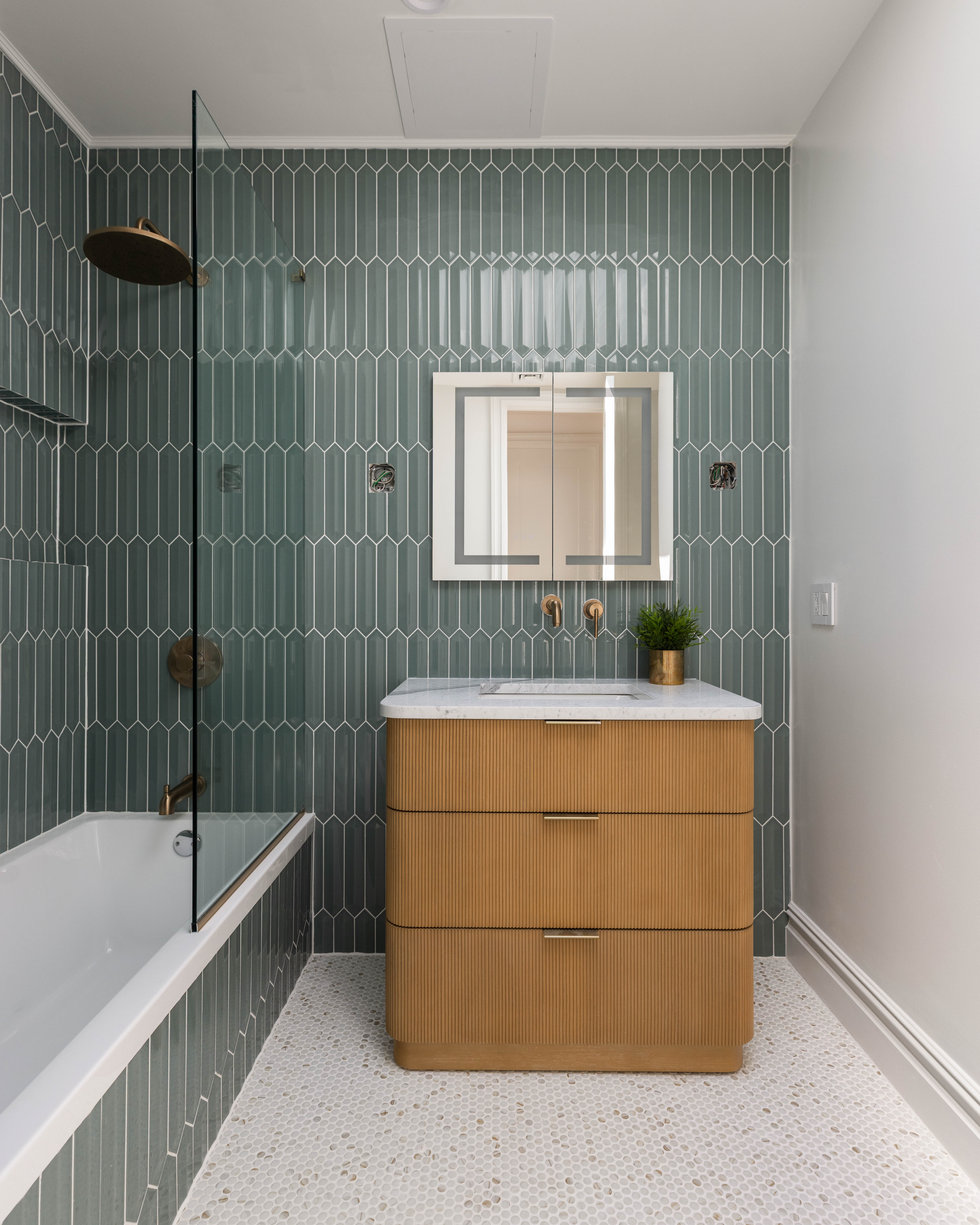 521 Monroe Street, Unit TWNHS Brooklyn, NY 11221 - Photo 15 of 17 a bathroom with a tub shower sink and mirror