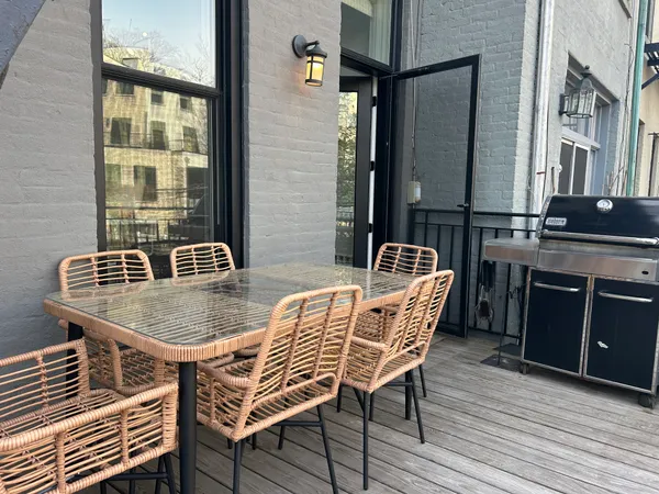 a dining room with furniture and wooden floor