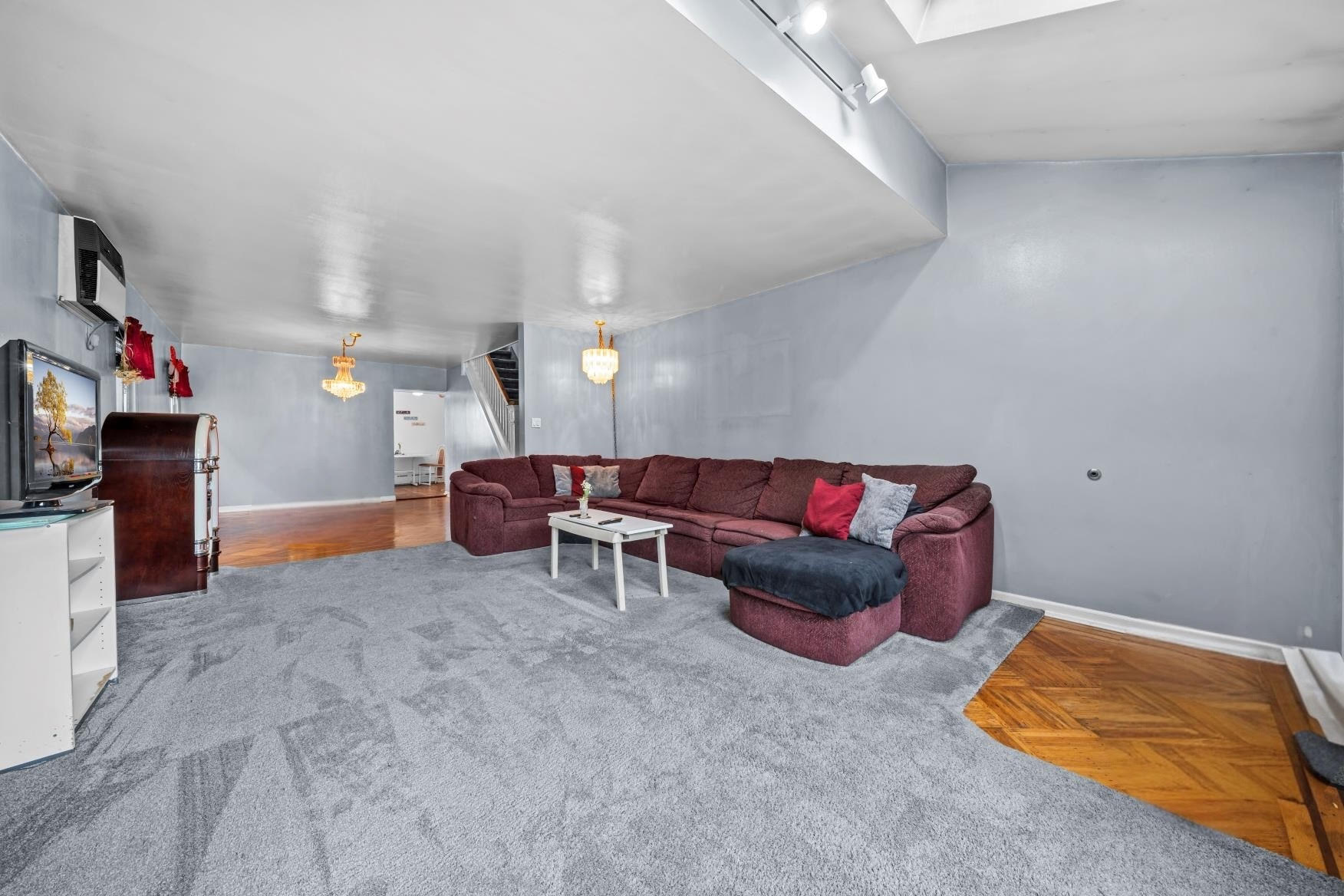 2018 Mill Avenue Brooklyn, NY 11234 - Photo 9 of 20 a living room with furniture and a flat screen tv