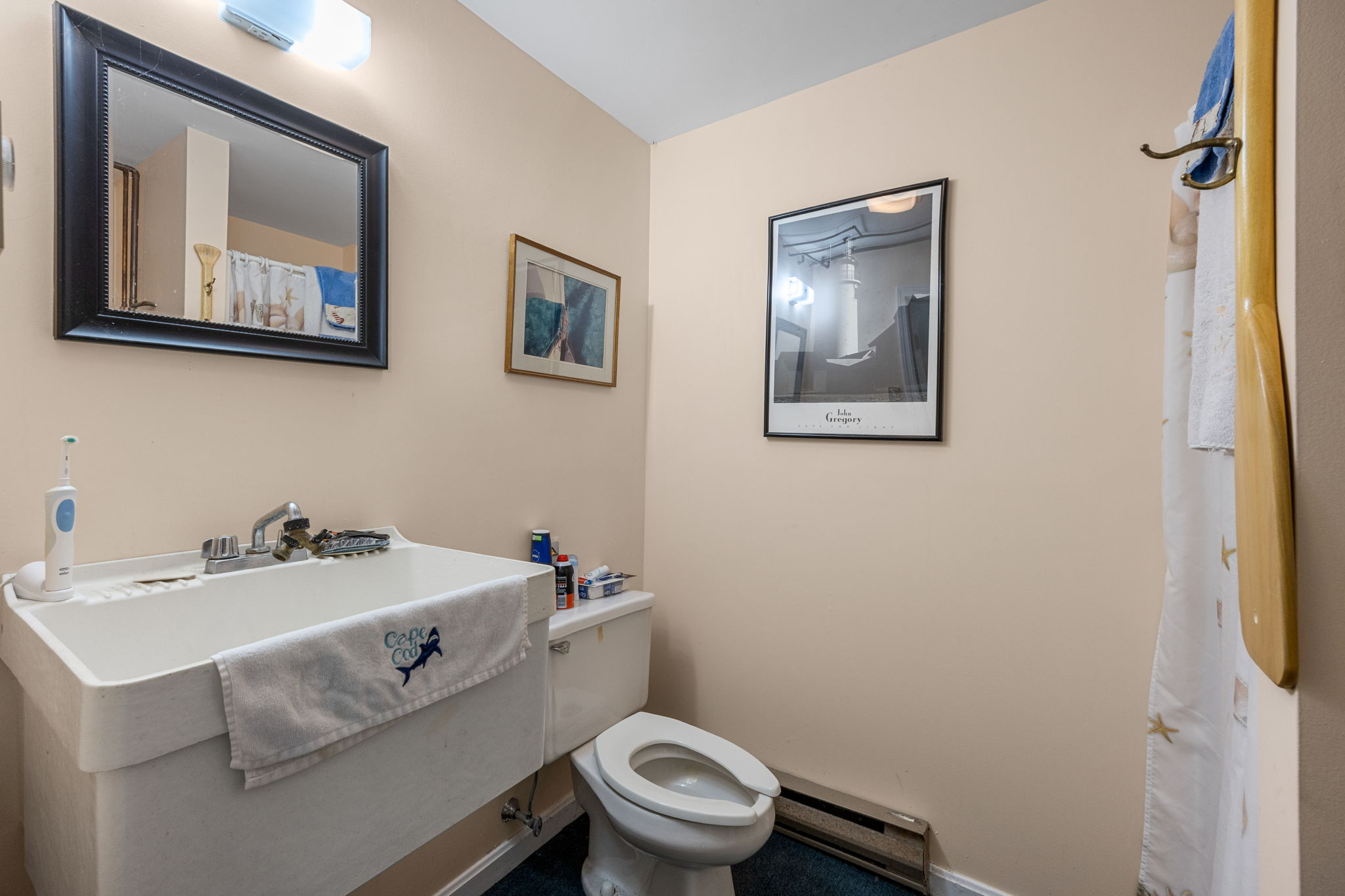9 Rayber Road Orleans, MA 02653 - Photo 24 of 31 a bathroom with a sink mirror and toilet