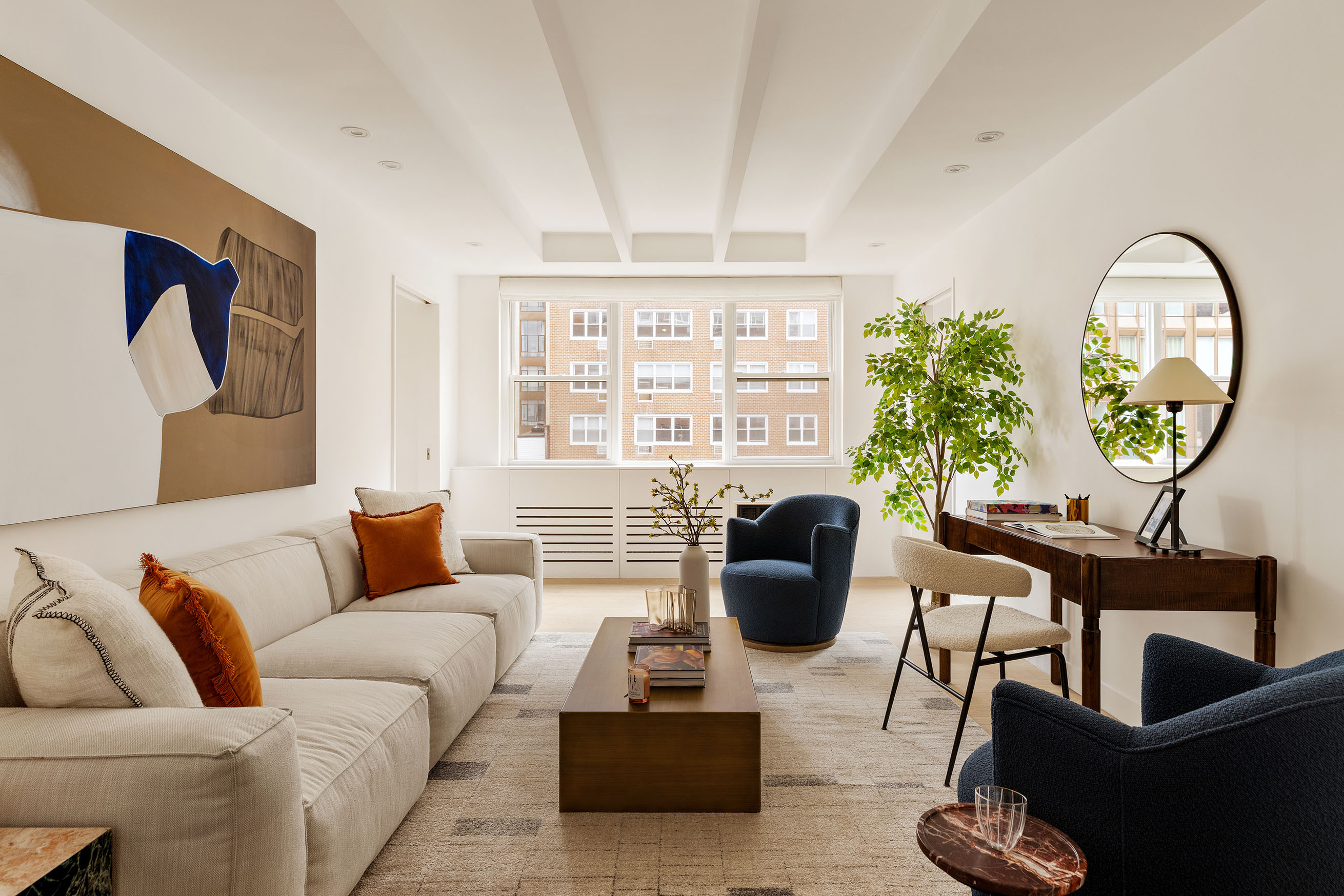 32 Gramercy Park South, Unit 8BD Manhattan, NY 10003 - Photo 7 of 20 a living room with furniture a chandelier and a large window