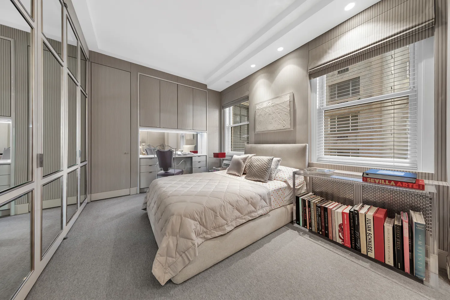 a bedroom with a bed next to a window