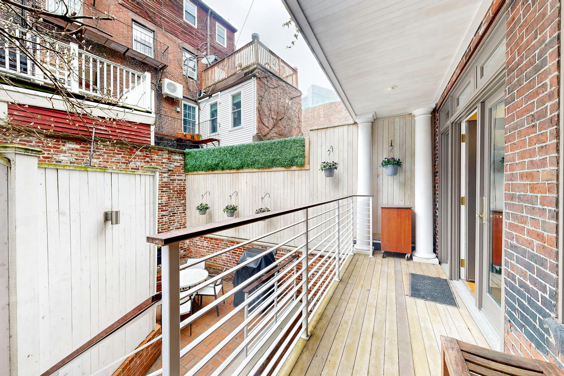 11 Fayette Street, Unit 1 Boston, MA 02116 - Photo 31 of 33 a view of balcony with wooden floor and fence