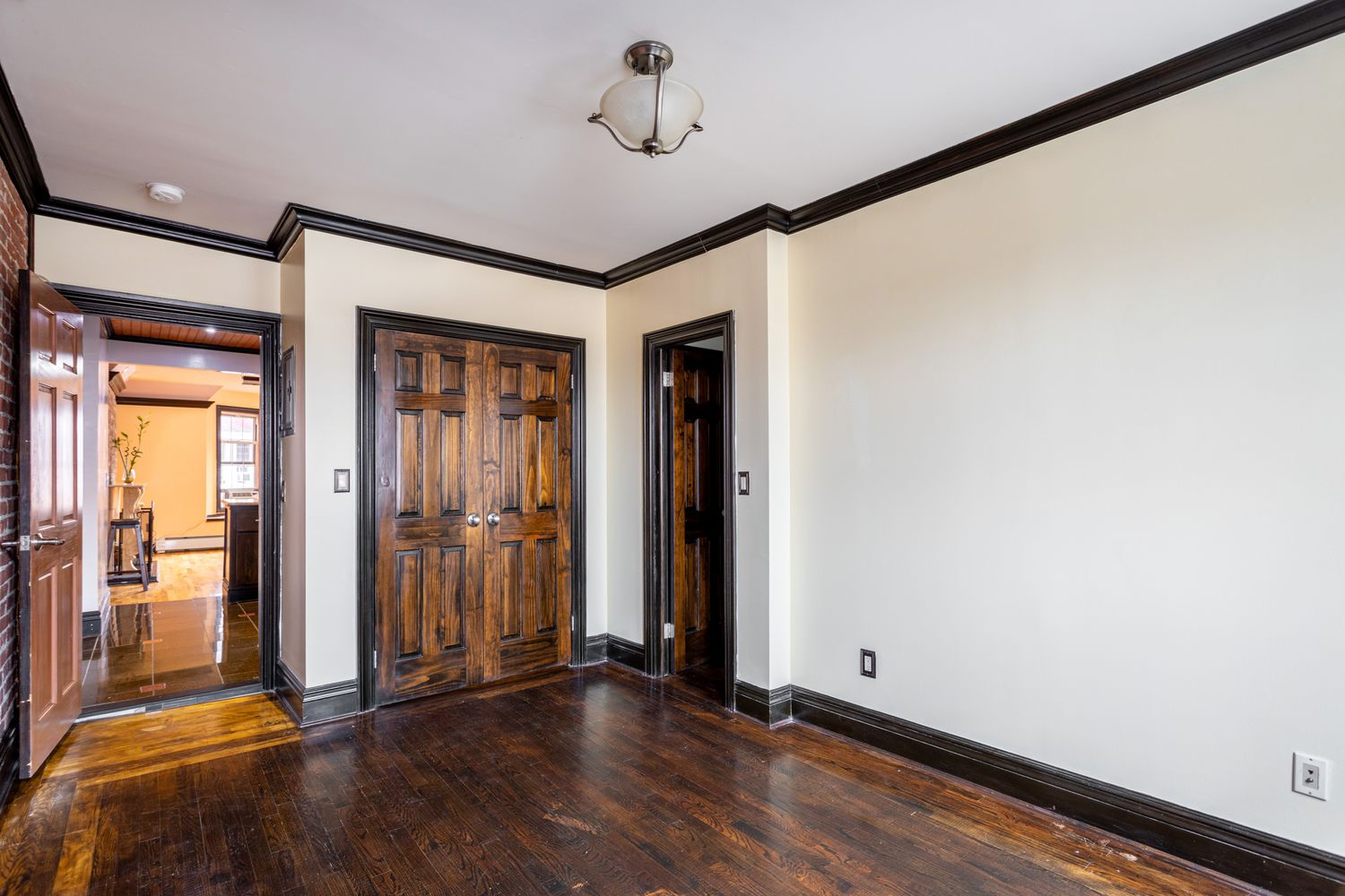 12 Virginia Place Brooklyn, NY 11213 - Photo 7 of 10 an empty room with wooden floor and windows