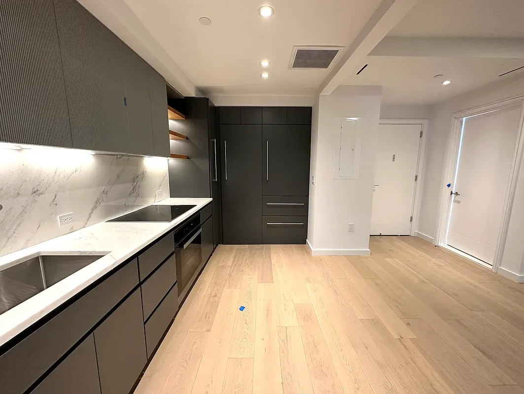 a bathroom with a sink and a large mirror