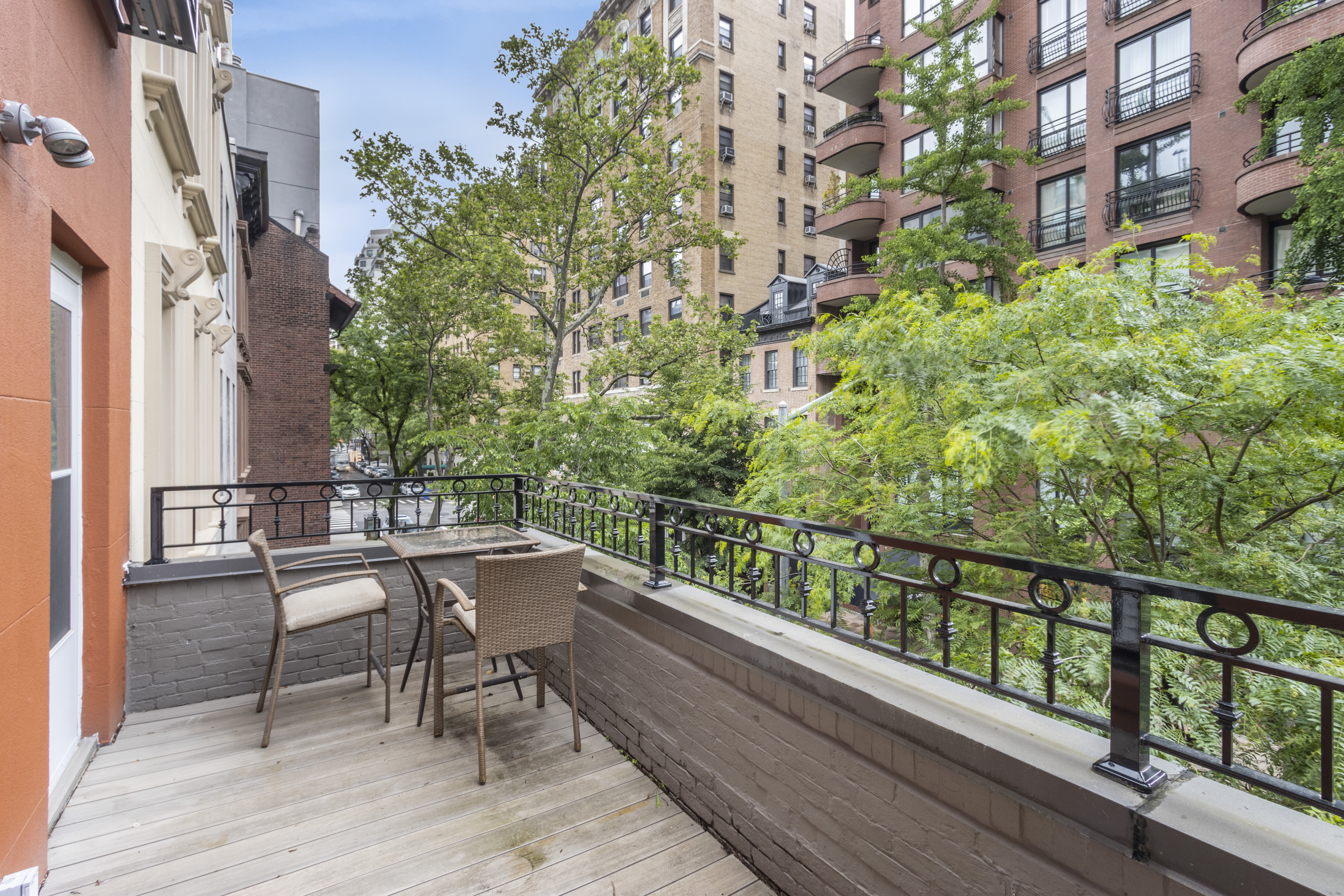160 East 74th Street, Unit 3 Manhattan, NY 10021 - Photo 11 of 12 a balcony with wooden floor and outdoor seating
