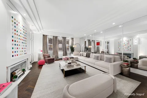 a living room with furniture large window and flat screen tv