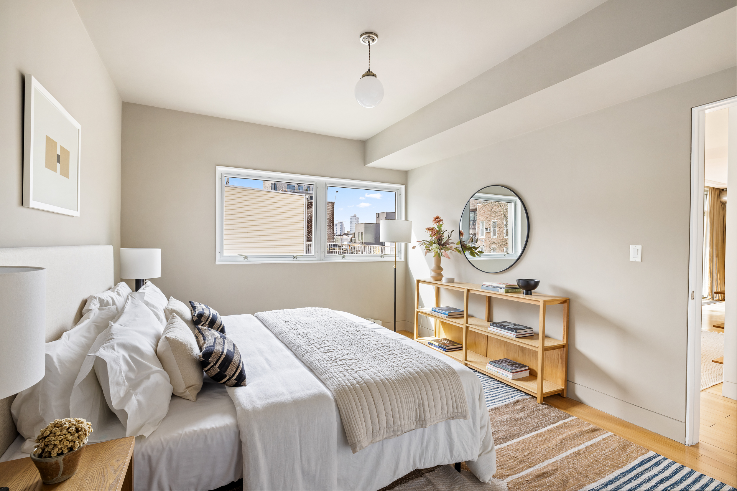 361 Manhattan Avenue, Unit 3AB Brooklyn, NY 11211 - Photo 8 of 21 a bedroom with bed and wooden floor