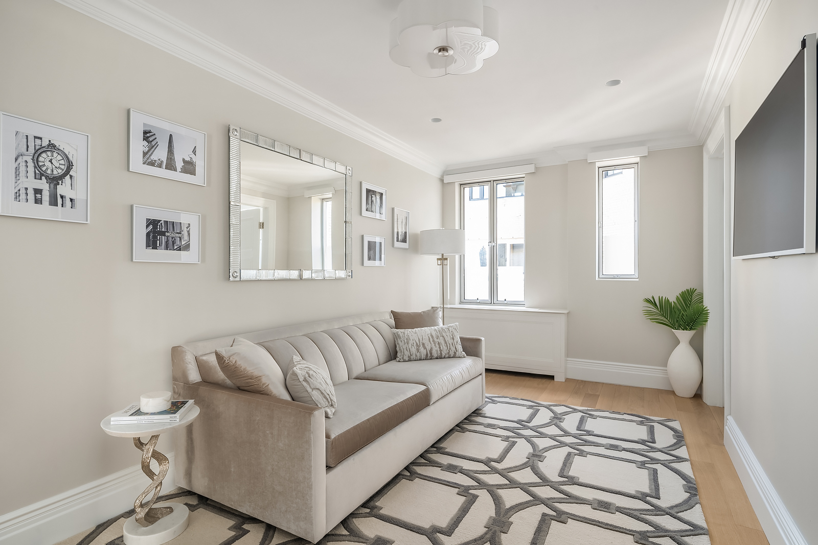 930 5th Avenue, Unit 18A Manhattan, NY 10021 - Photo 12 of 16 a living room with furniture and a rug