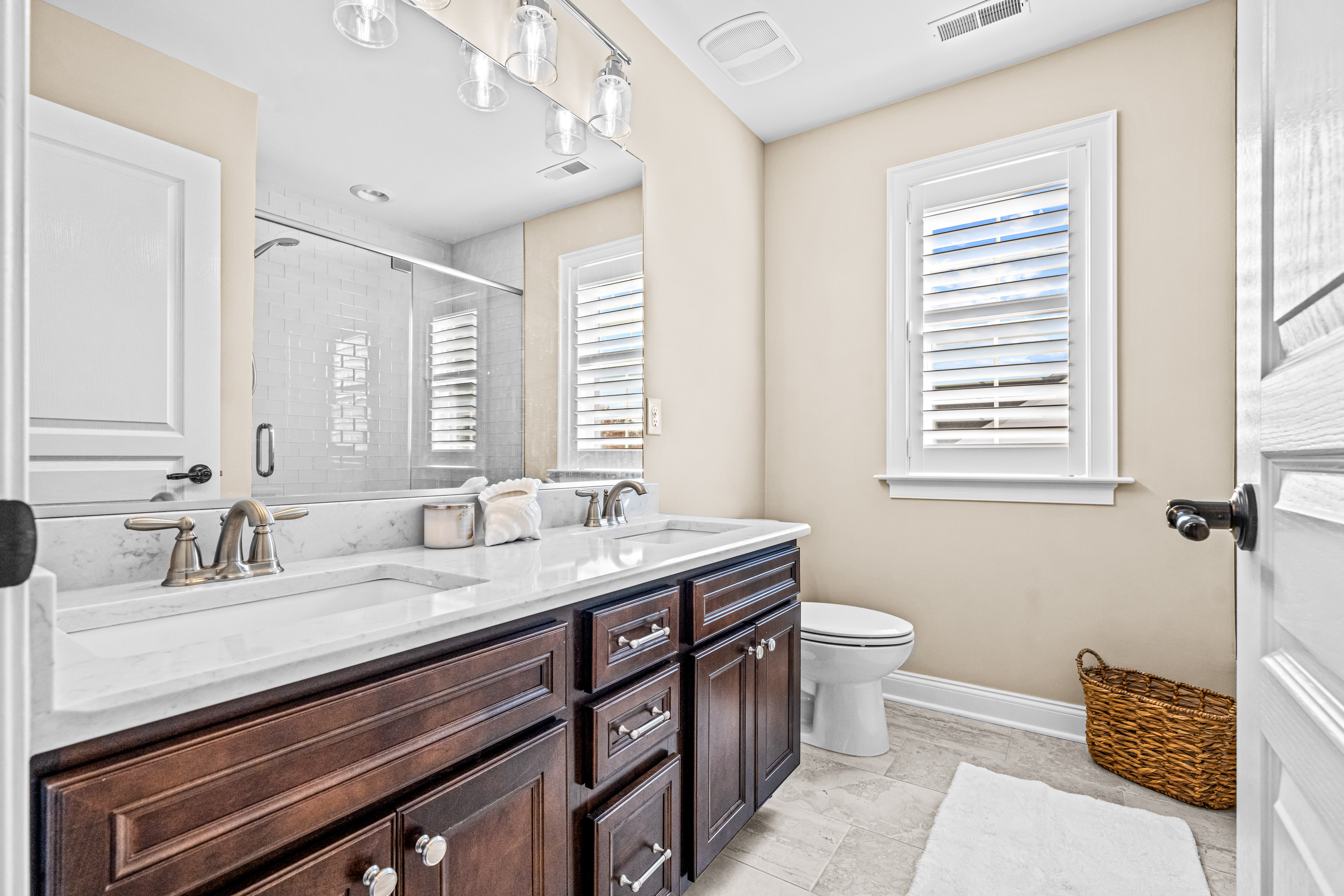 52 Wellesley Way Marlton, NJ 08053 - Photo 65 of 98 a bathroom with a granite countertop sink a toilet a mirror and a window