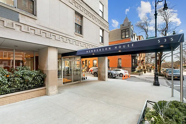 a view of a building with sitting area