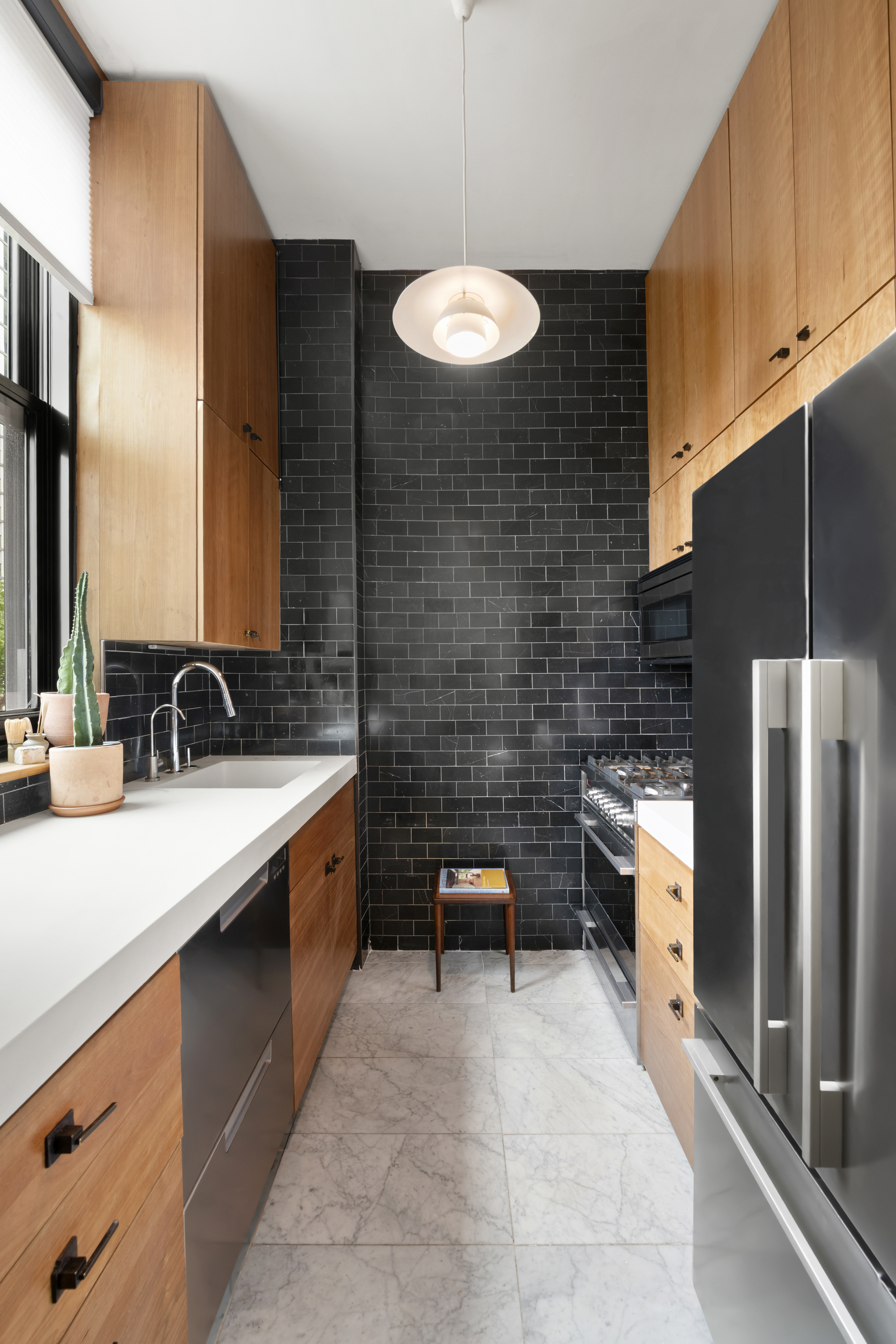 372 Dekalb Avenue, Unit 6E Brooklyn, NY 11205 - Photo 5 of 16 a large kitchen with stainless steel appliances granite countertop a sink stove and refrigerator