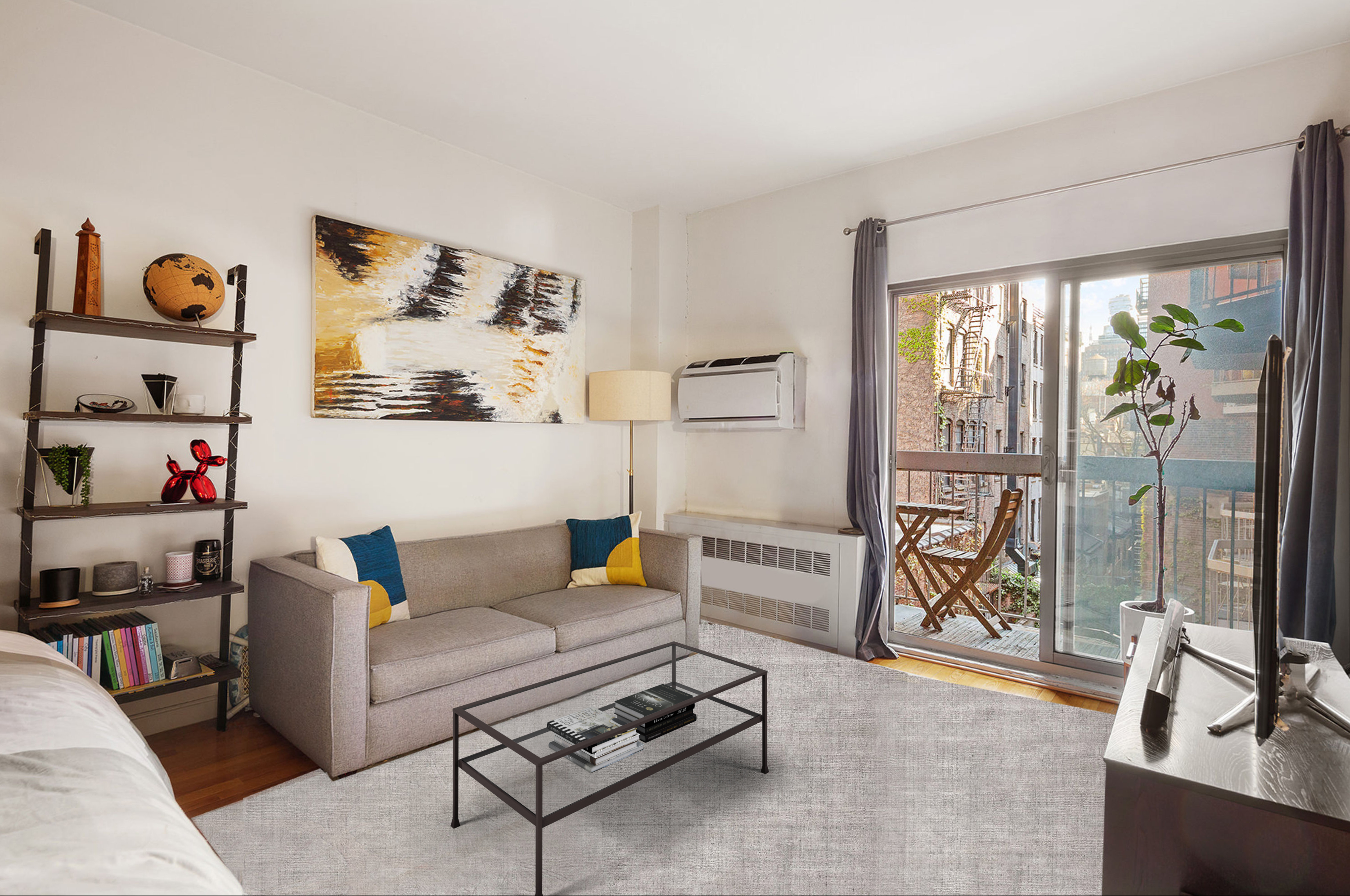 a living room with furniture and a floor to ceiling window