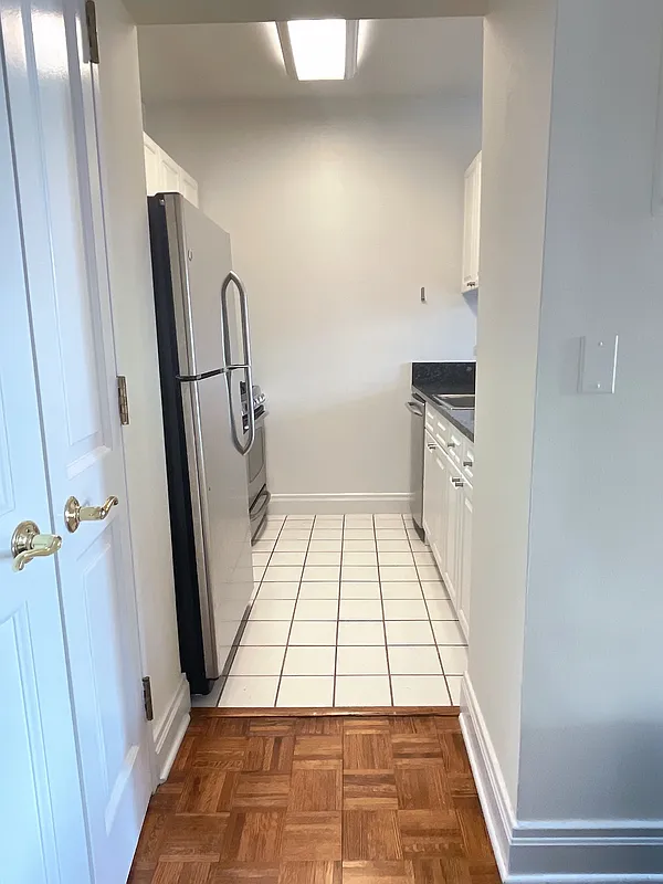 400 East 90th Street, Unit 15B Manhattan, NY 10128 - Photo 4 of 15 a view of a bathroom with white door