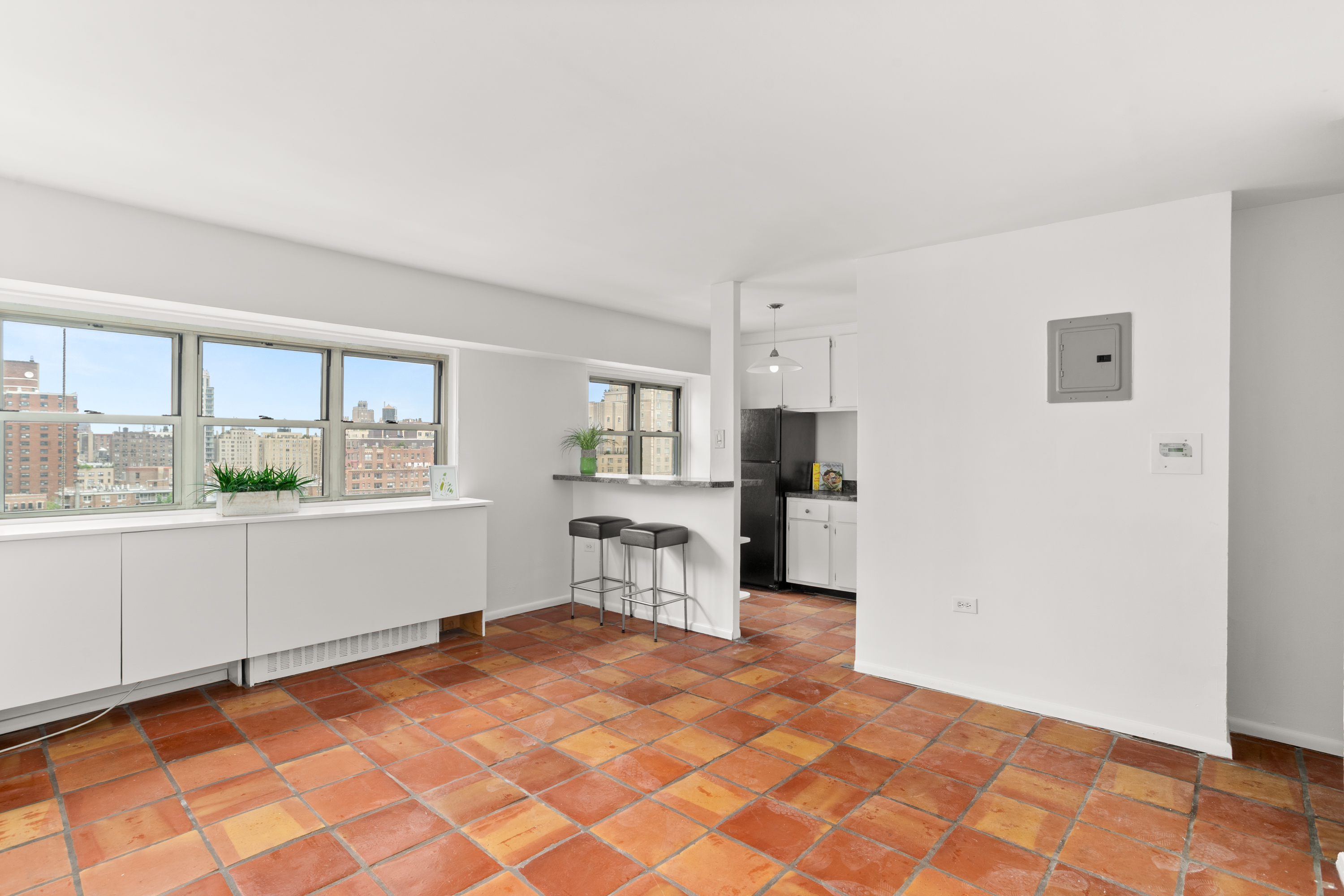 609 Columbus Avenue, Unit 14E Manhattan, NY 10024 - Photo 12 of 24 a room with a bed and a large window