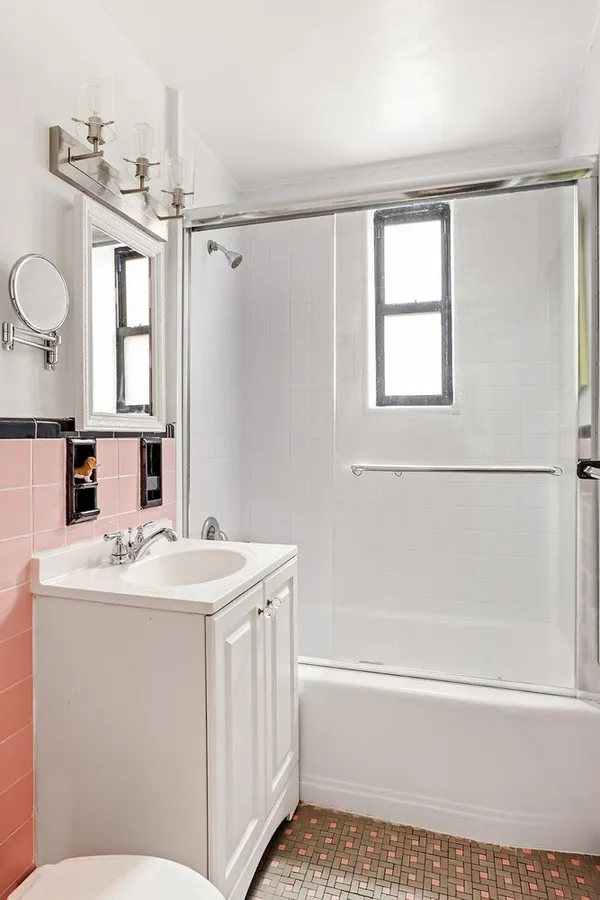 a bathroom with a sink a toilet and a bathtub