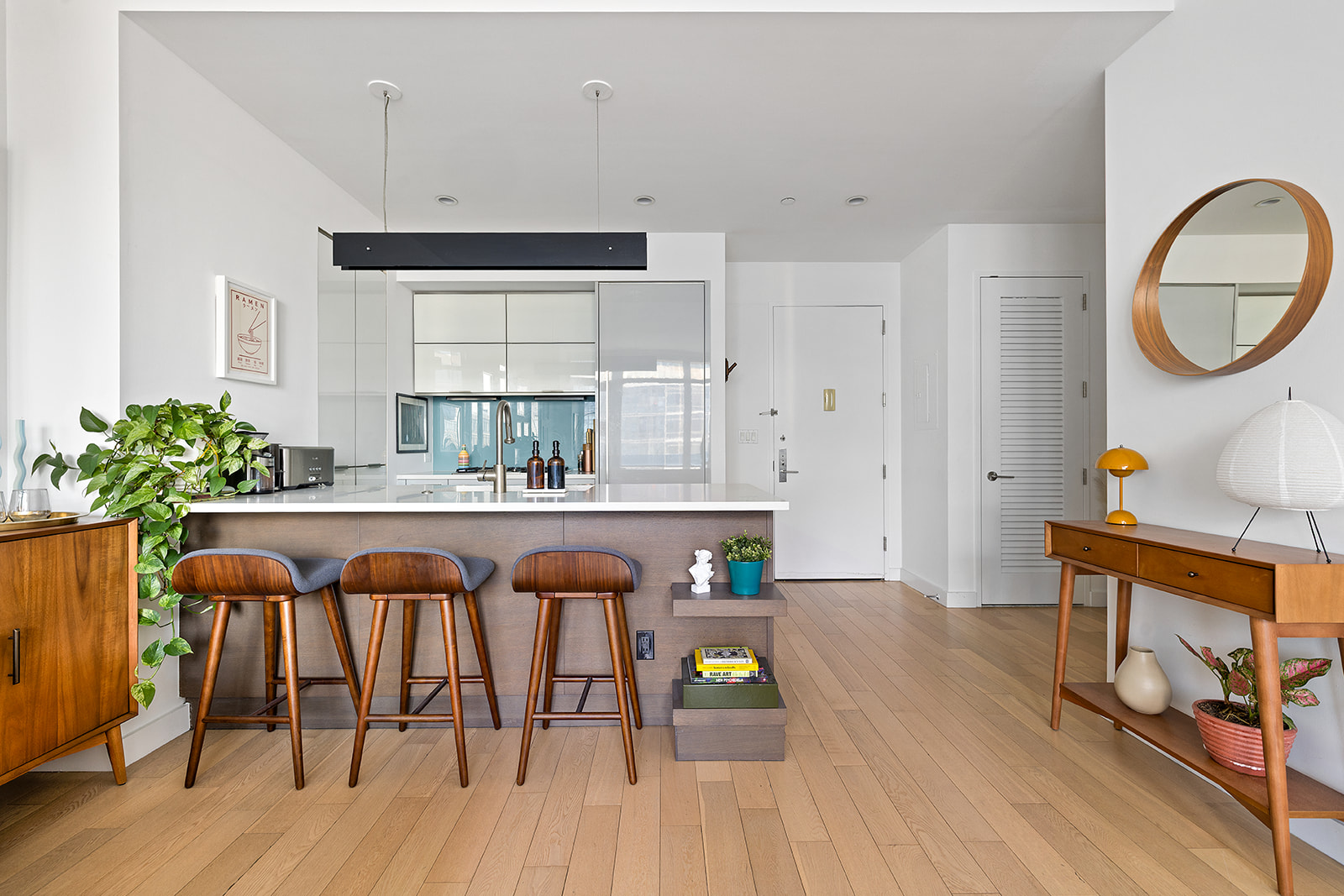 22 North 6th Street, Unit PH2A Brooklyn, NY 11249 - Photo 5 of 12 a kitchen with stainless steel appliances granite countertop a dining table chairs stove and cabinets