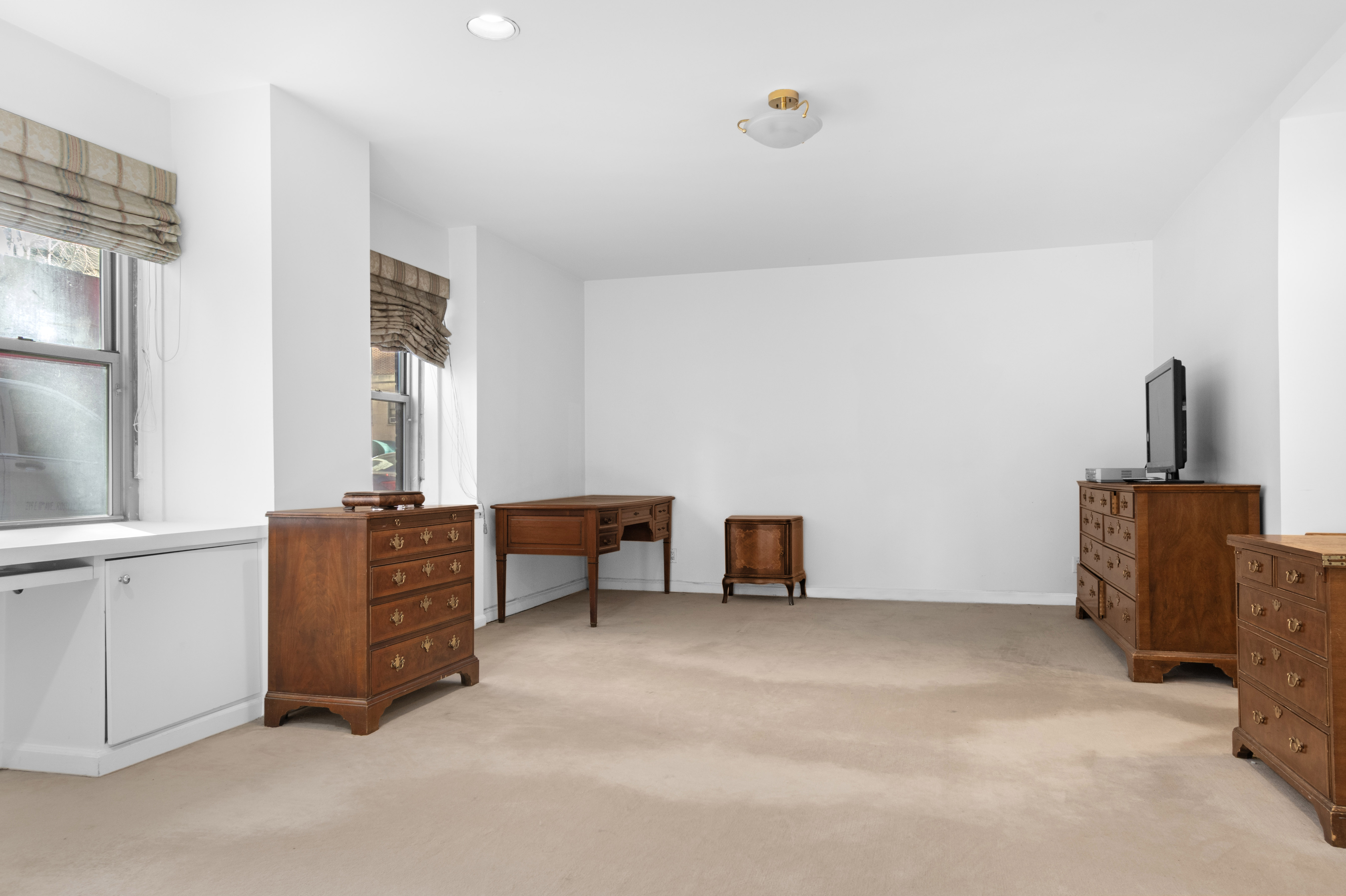 16 Sutton Place, Unit 1A/1B Manhattan, NY 10022 - Photo 7 of 25 a room with furniture and window
