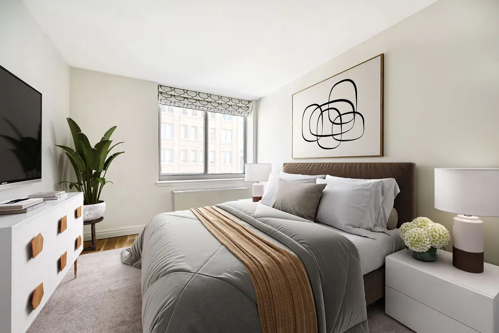 a bedroom with a bed and a window