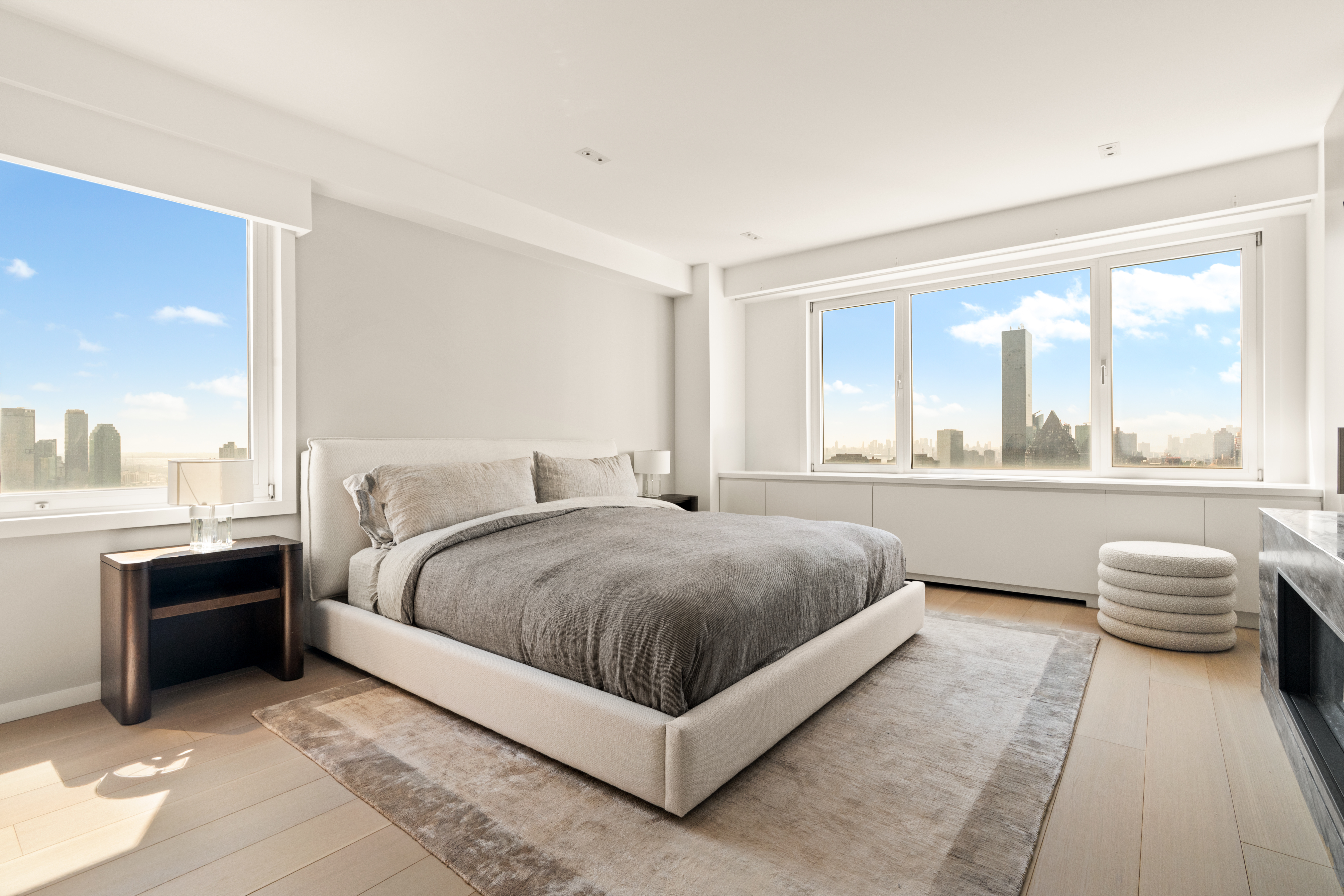 303 East 57th Street, Unit 44G Manhattan, NY 10022 - Photo 7 of 19 a bedroom with a large bed and a large window