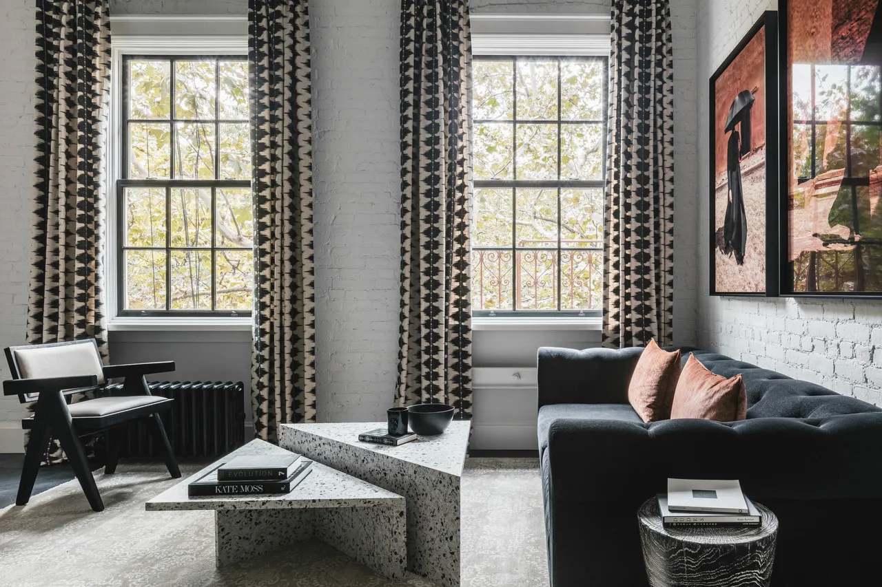 a living room with furniture and a window