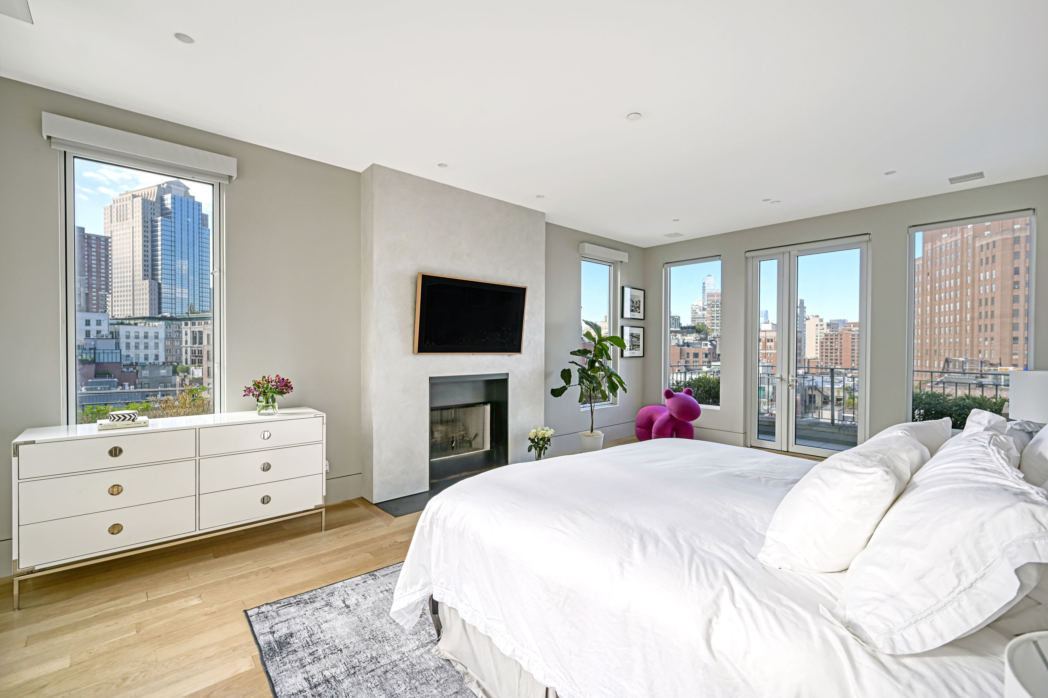 53 Leonard Street, Unit PH Manhattan, NY 10013 - Photo 18 of 24 a bedroom with a bed and a flat screen tv