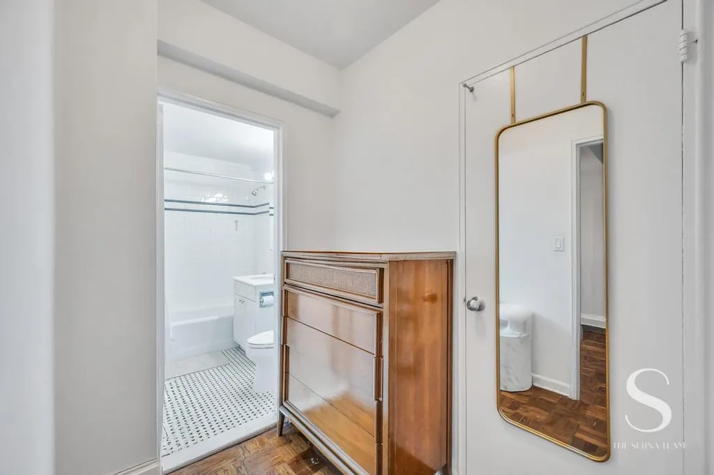 a bathroom with a glass shower door