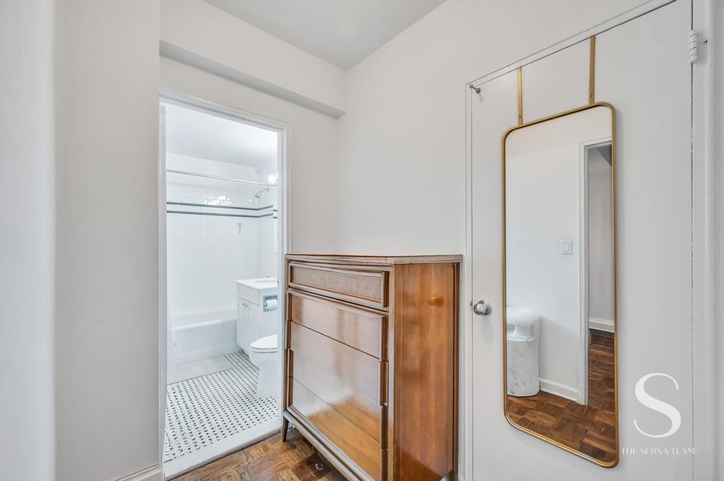 7 Lexington Avenue, Unit 5E Manhattan, NY 10010 - Photo 9 of 14 a bathroom with a glass shower door
