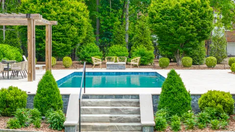a view of a swimming pool with a patio