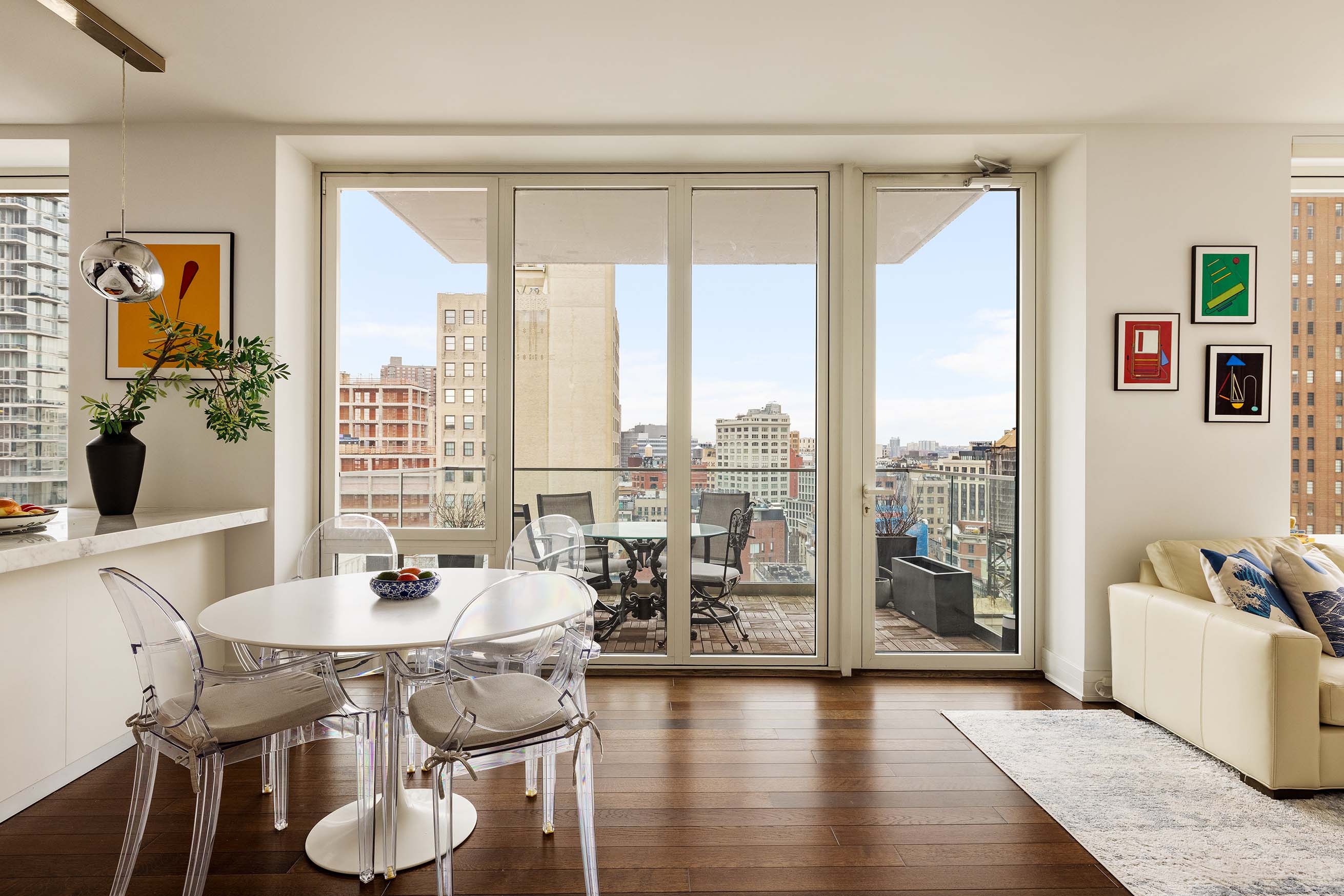 5 Franklin Place, Unit 14A Manhattan, NY 10013 - Photo 1 of 23 a dining room with wooden floor and large windows