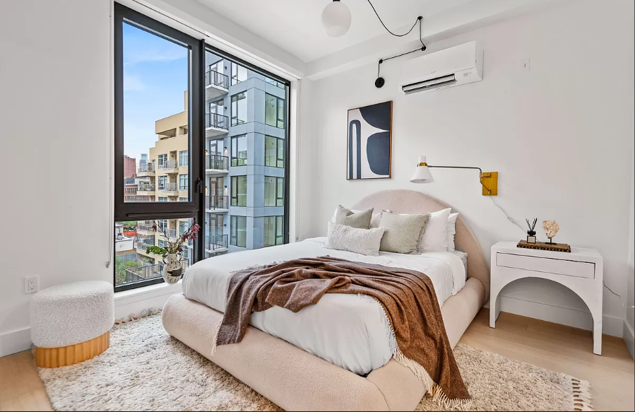 218 Front Street, Unit 231 Brooklyn, NY 11201 - Photo 11 of 35 a bedroom with a large bed and a window