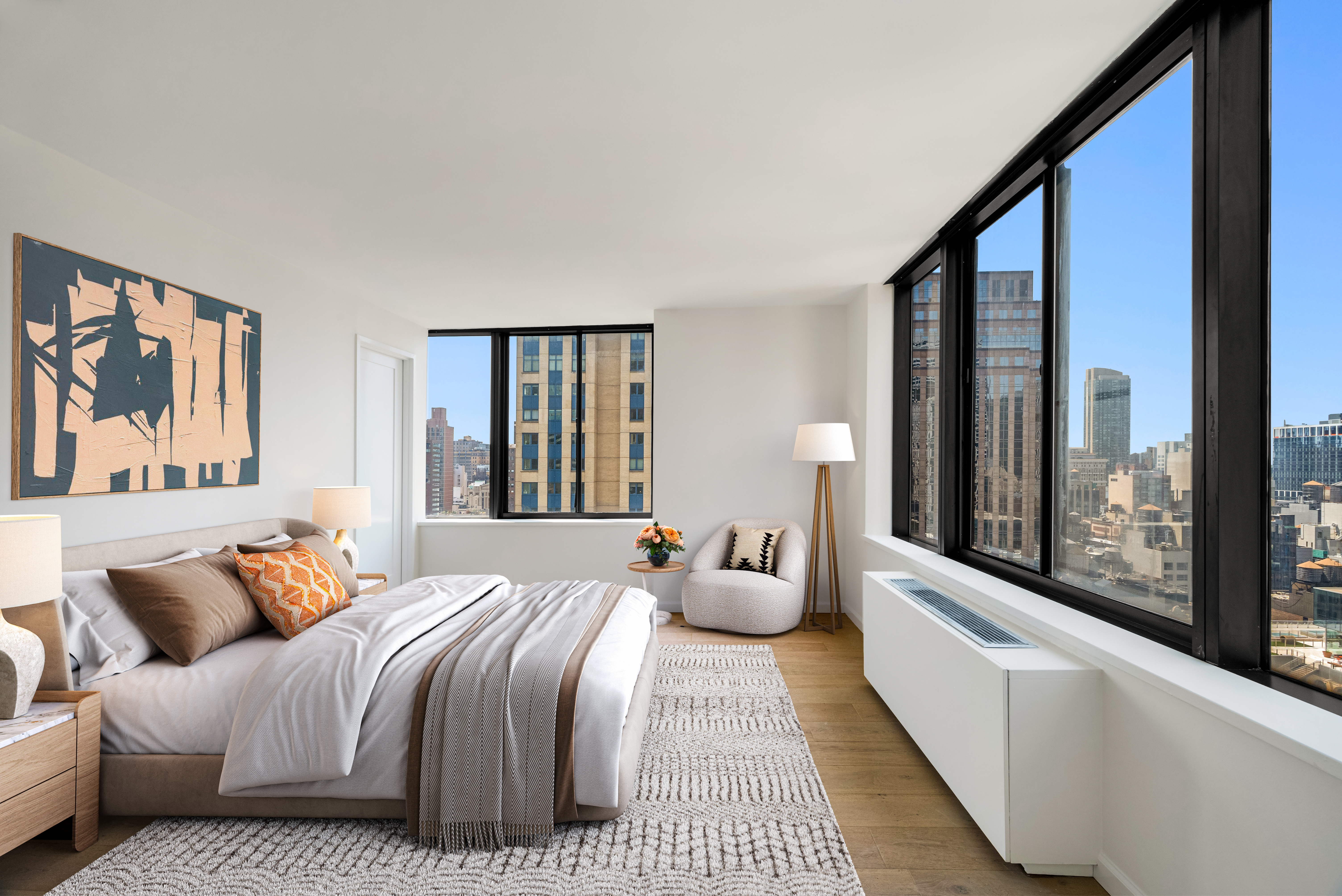 445 5th Avenue, Unit 26C Manhattan, NY 10016 - Photo 2 of 11 a bedroom with a large bed and a large window