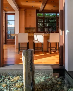 a view of a hallway with toilet and entryway