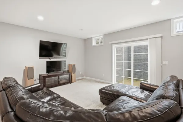 a front view of a house with a yard table and chairs