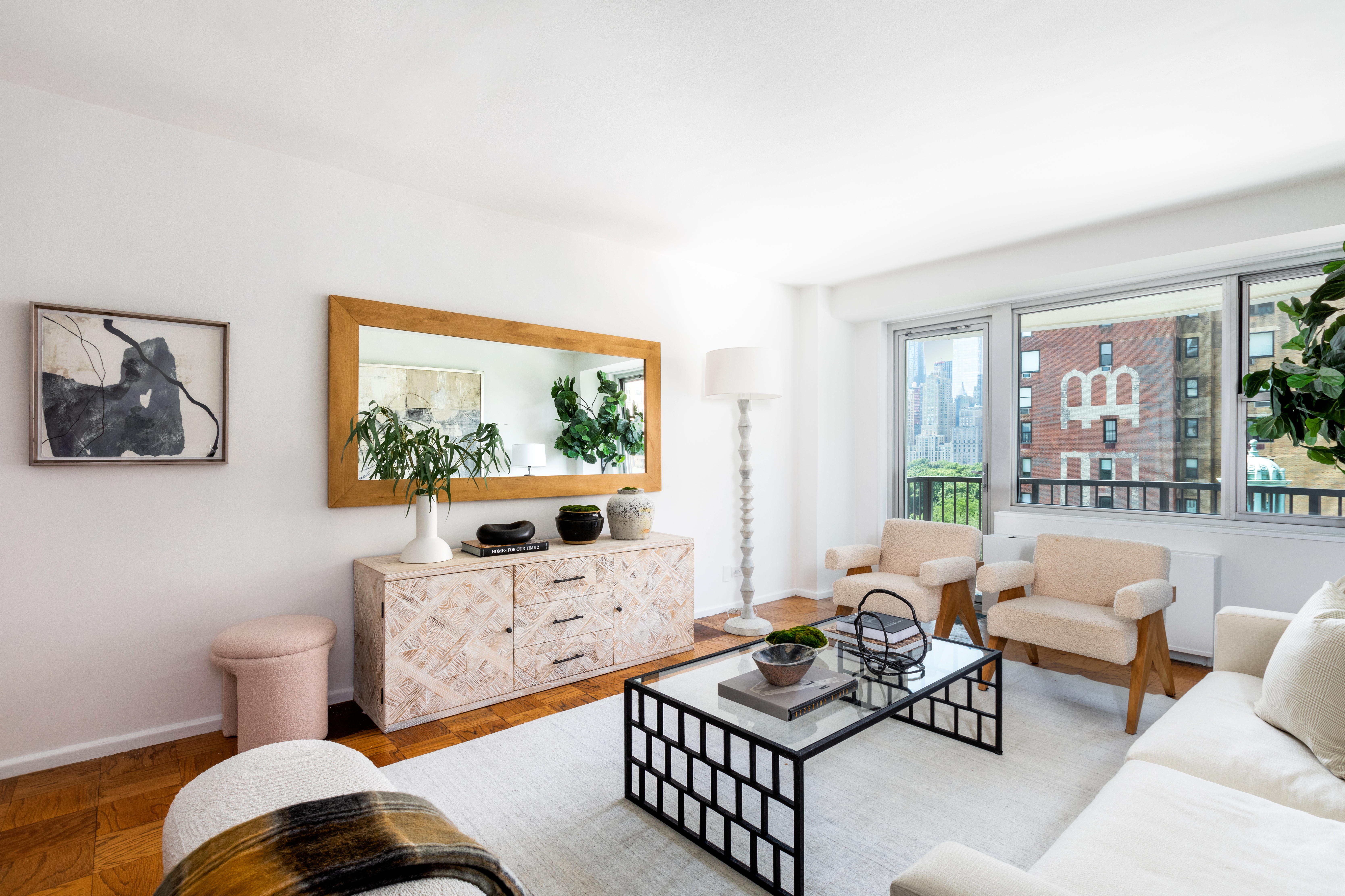 80 Central Park West, Unit 12C Manhattan, NY 10023 - Photo 5 of 27 a living room with furniture and a flat screen tv