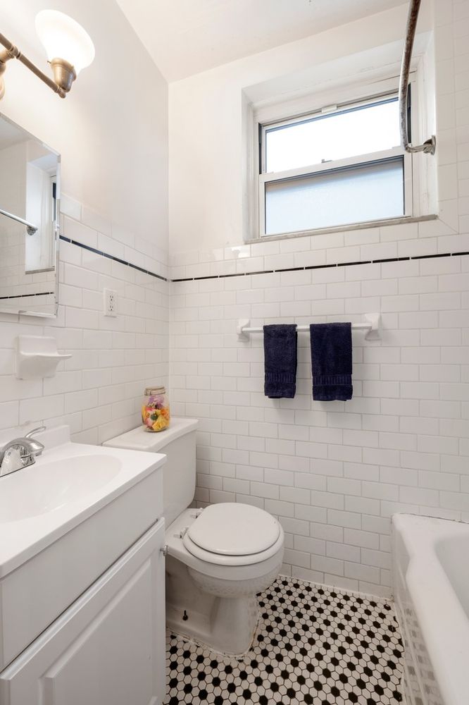 a bathroom with a toilet a sink and a shower