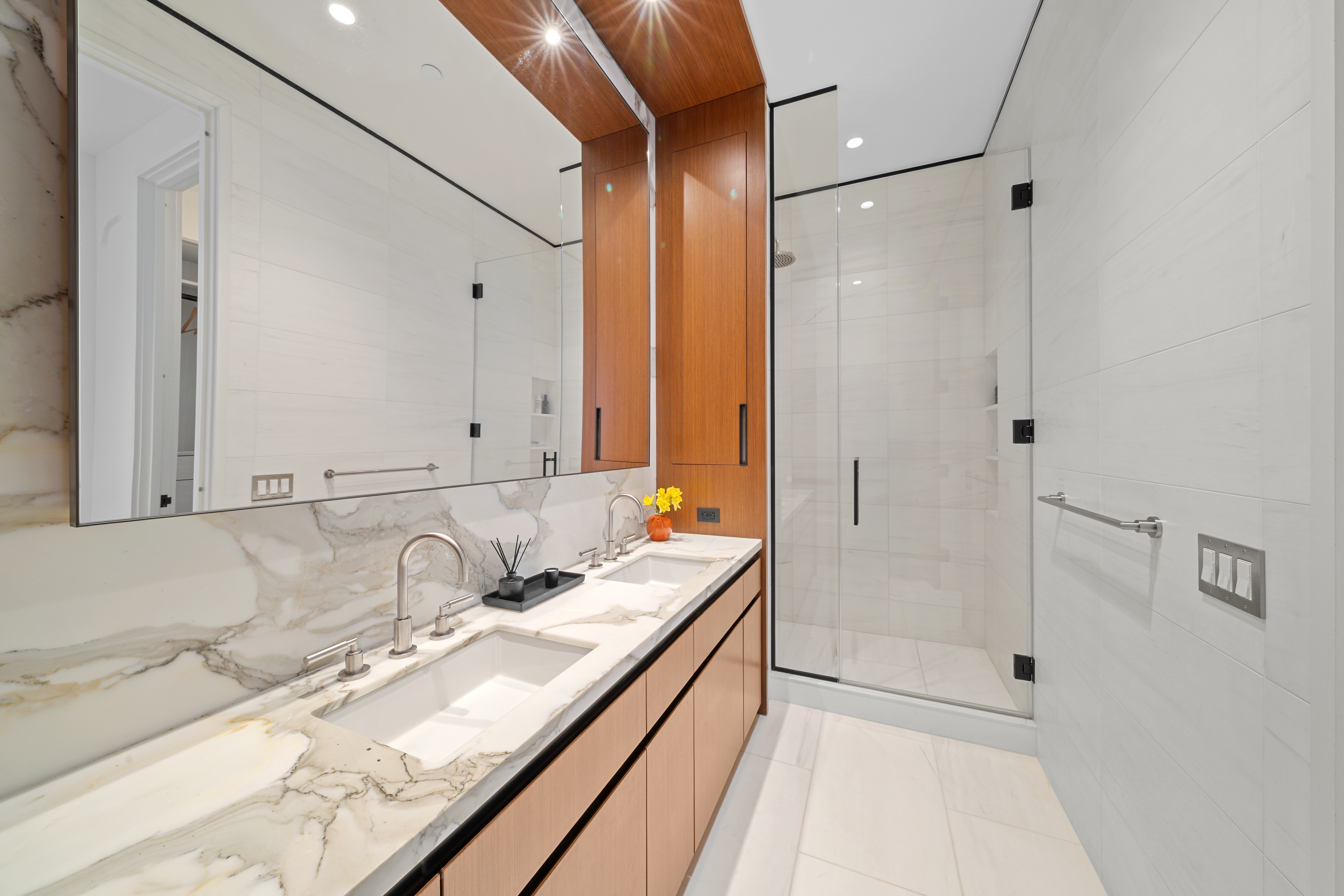 15 East 30th Street, Unit 19B Manhattan, NY 10016 - Photo 22 of 40 a bathroom with a granite countertop sink mirror and double